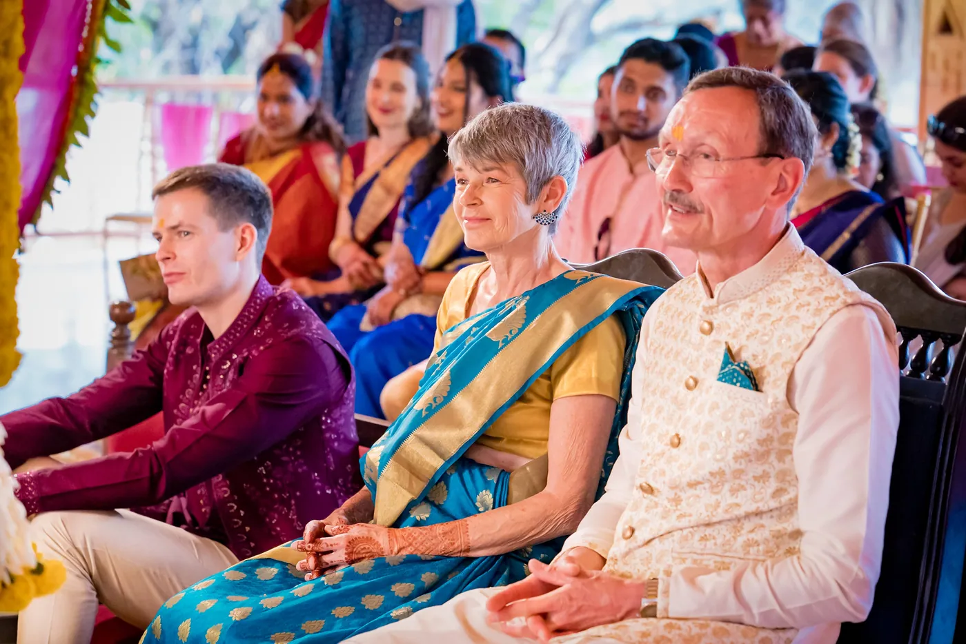 Stefan sits in the front row beside his parents during the ceremony