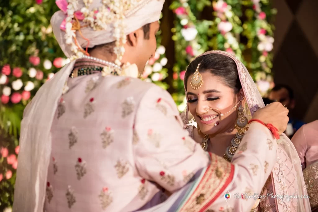 Ramit and Arushi embrace during the garland exchange at their NRI wedding at Ramada Lucknow